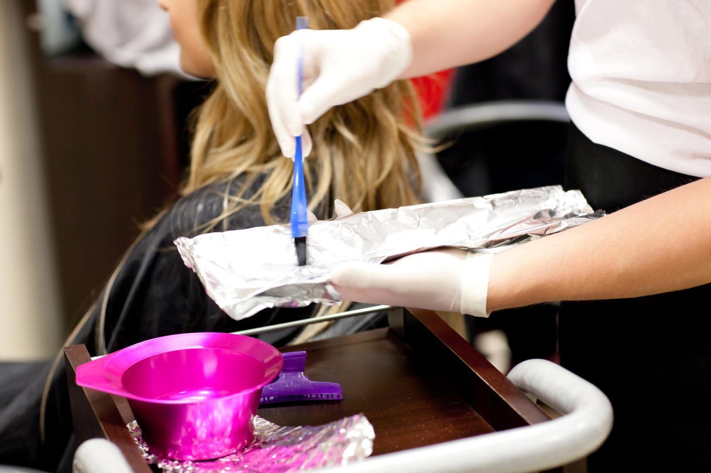 Colour being mixed and applied in the salon